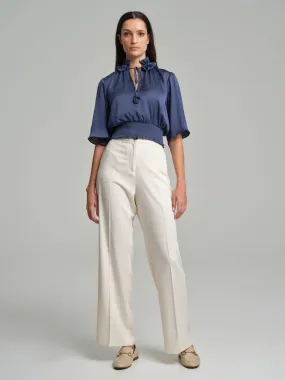 Short frilled blouse with smocked waistband