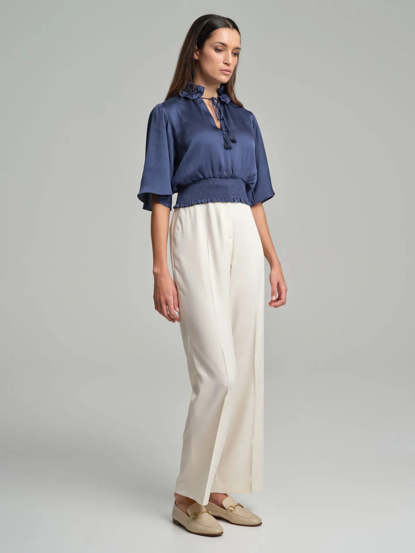 Short frilled blouse with smocked waistband